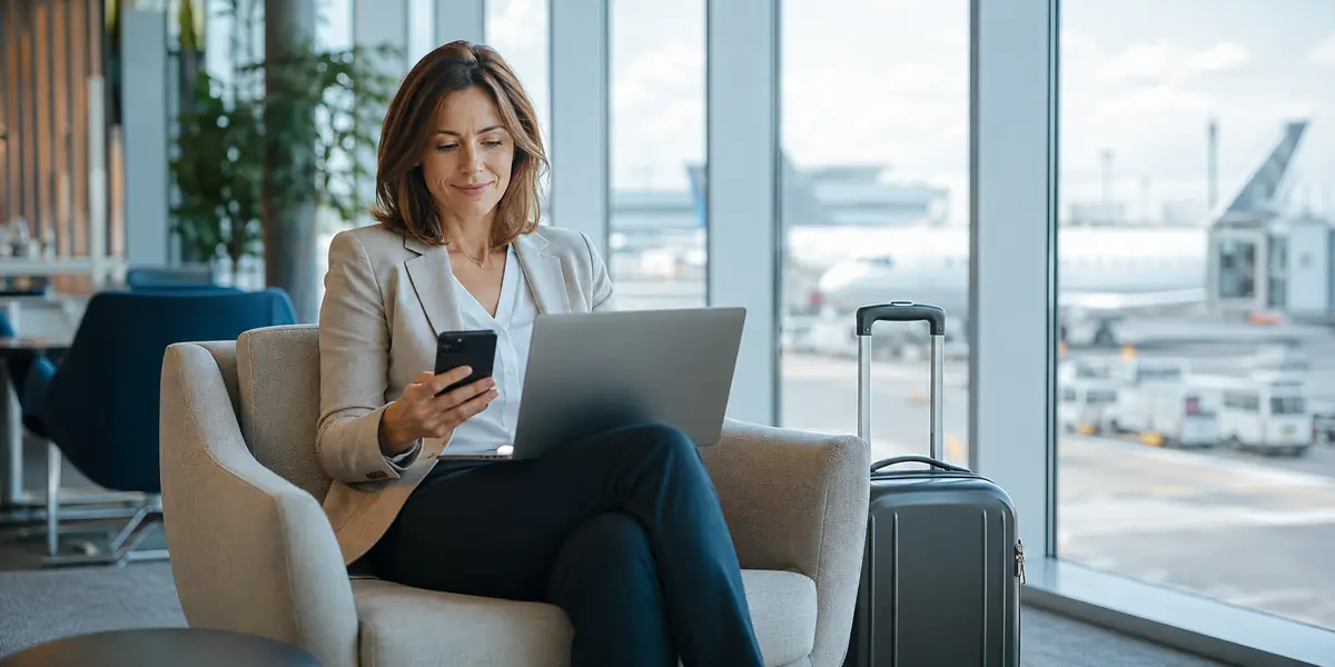 Business traveller working in an airport lounge
