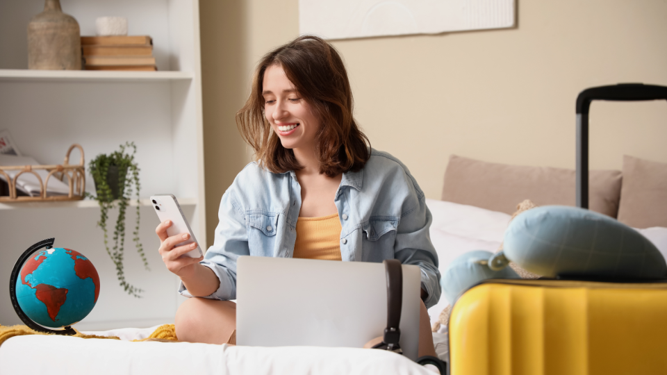 Travellers checking their ski travel insurance policy before a winter holiday